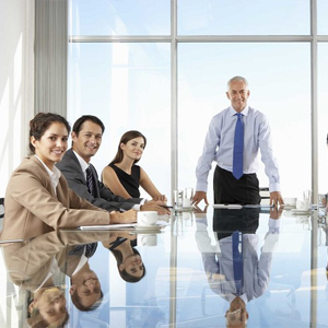 Multi ethnic business executives at a meeting discussing a work